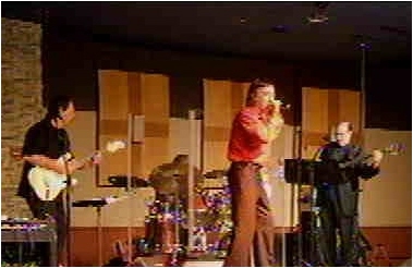 Tom Sadge performs live on stage with band at casino. PHOTO: Tom Ziber