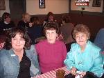 Three ladies share in the fun at the Neil Diamond Chicago Neil Diamond Birthday Party pizza dinner. PHOTO: Tom Sadge