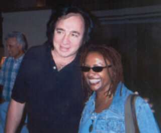 Tom Sadge with Julia Waters of Neil Diamond band.